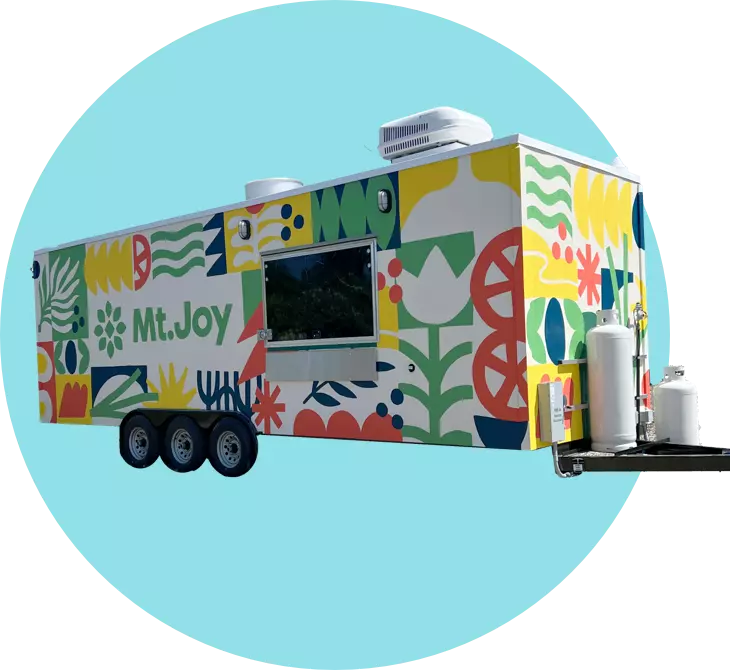 A food truck with a colorful design on it.